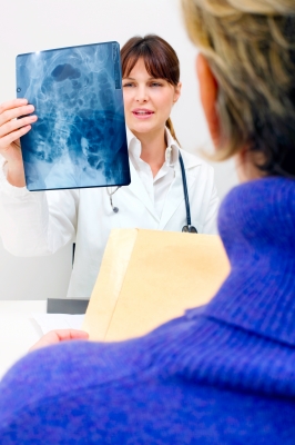 A woman reviewing her laboratory results with her physician.